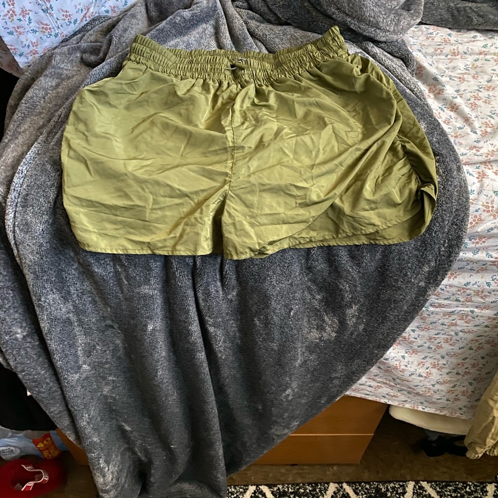 Green shorts trash bag material small if you have bigger thighs